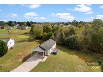 Aerial view showing house, yard, and neighborhood at 301 Walkers Ridge Dr, Shelby, NC 28152