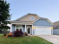 Charming two-story home with manicured lawn and a two-car garage in a desirable neighborhood at 3157 Delaware Dr, Denver, NC 28037