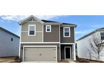 Charming two-story home featuring mixed siding, a front-entry two-car garage, and a welcoming front porch at 151 Shepherds Landing Dr, Mooresville, NC 28115