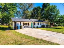 Cute ranch home with a landscaped yard and spacious driveway at 1378 8Th Nw St, Hickory, NC 28601