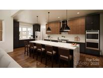 Modern kitchen with two-toned cabinetry, large island, and stainless steel appliances at 1935 Weddington Rd # A, Matthews, NC 28105