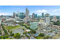 Drone view of uptown Charlotte, NC skyline, buildings, and park at 708 N Davidson St, Charlotte, NC 28202