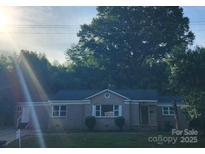 Charming single-story home with a well-manicured front yard and inviting curb appeal at 3337 Eastway Dr, Charlotte, NC 28205
