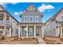 Charming two-story home with a welcoming front porch and classic architectural details at 714 Barrel Aly, Fort Mill, SC 29715