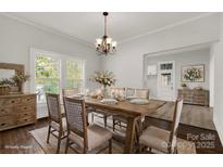 Bright dining room with farmhouse table and chandelier at 305 N White St, Lancaster, SC 29720