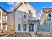 Charming two-story white home with inviting entry and landscaped front yard at 613 Hops Aly, Fort Mill, SC 29715