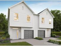 Beautiful two-story home featuring white siding and a two-car gray garage at 9247 Eleanor Dr, Charlotte, NC 28214