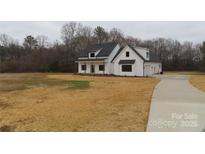 Beautiful two-story home with a large front yard and a paved driveway at 1020 N Shiloh Rd, York, SC 29745