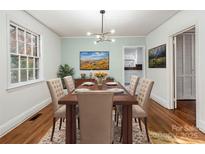 Traditional dining room with hardwood floors, light green walls, and room for six at 412 Keels Ave, Rock Hill, SC 29730