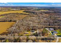 Aerial view showing house on wooded lot at 797 Chief Thomas Rd, Harmony, NC 28634