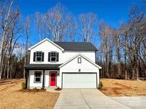 Two-story house with red door, white siding, and a gray roof at 737 E Memorial Hwy, Harmony, NC 28634