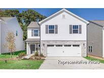 Two-story home with gray stone accents, white siding, and an attached two-car garage at 1027 Freeman View Dr # 151P, Albemarle, NC 28001