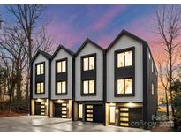 Three modern townhouses with attached garages and stylish exterior at 158 Mattoon St, Charlotte, NC 28216