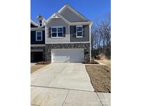 Two-story house with gray siding, white garage door, and landscaping at 3540 Nimbell Rd, Monroe, NC 28110