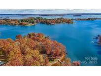 Stunning aerial view of Lake Norman showcasing vibrant fall foliage and waterfront properties at 109 Twiggs Ln, Mooresville, NC 28117