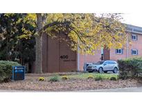 Brick building exterior, showcasing landscaping and parking at 400 Queens Rd # E5, Charlotte, NC 28207