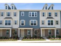 Three-story townhouses with neutral siding, brick accents, and front porches at 7117 Brookview Ln, Sherrills Ford, NC 28673