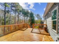 Inviting wooden deck perfect for entertaining with string lights and wooded view at 25622 Seagull Dr # 645, Lancaster, SC 29720