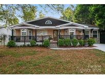 Charming craftsman style home with front porch and landscaping at 138 Wyanoke Ave, Charlotte, NC 28205