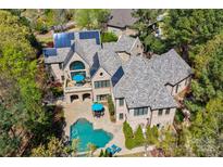 Luxury home with solar panels and a beautiful pool at 16908 Ashton Oaks Dr, Charlotte, NC 28278