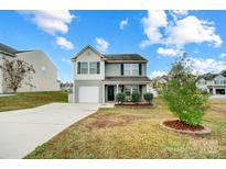 Two-story house with gray siding, white garage door, and landscaping at 1964 Clear Brooke Dr, Kannapolis, NC 28083