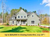 Charming two-story home with a manicured lawn, classic architecture, and inviting curb appeal at 1865 Rock Hill Church Rd # 3, Matthews, NC 28104