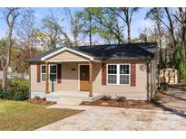 Charming single-story home featuring a cozy front porch and well-maintained landscaping at 108 W Maryland Ave, Bessemer City, NC 28016
