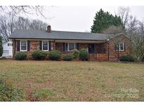 Charming brick home with mature landscaping and inviting front entrance at 115 Turner St, Lincolnton, NC 28092