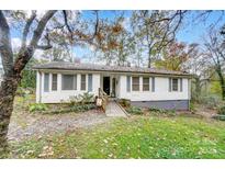 One-story home with white siding, multiple windows, and a ramp at 4401 Trace Ave, Gastonia, NC 28056