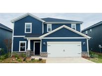 Charming two-story home with a blue exterior, white trim, stone accents, and a two-car garage at 106 Obadiah Ct, Troutman, NC 28115