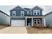 Two-story house with gray siding, white trim, and a two-car garage at 107 Obadiah Ct, Troutman, NC 28115
