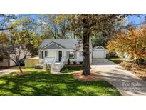 White house with gray roof and landscaped yard at 1320 Brook Rd, Charlotte, NC 28205