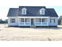 Newly constructed home with gray siding, white trim, and a covered porch at 310 Genell Ln, Rock Hill, SC 29730