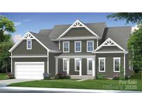 Charming two-story home featuring a front porch, attached garage, and well-maintained lawn at 4265 Candlewood Dr, Sherrills Ford, NC 28673