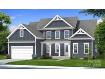 Charming two-story home with a manicured lawn, attached garage, and beautiful architectural details at 4265 Candlewood Dr, Sherrills Ford, NC 28673