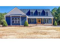 Craftsman style home with blue siding, white accents, and a large front porch at 636 Edwards Rd, Fort Lawn, SC 29714