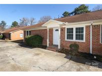 Charming brick home featuring a well-maintained front yard and inviting entrance at 1106 Chandler Dr, Rock Hill, SC 29732