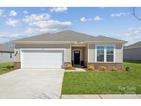Charming single-story home with a well-manicured lawn and attached garage at 1129 Hallman Branch Ln, Lincolnton, NC 28092