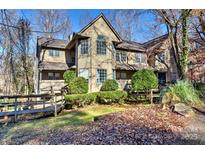 Two-story townhome with charming facade and landscaping at 6125 Gray Gate Ln # F, Charlotte, NC 28210