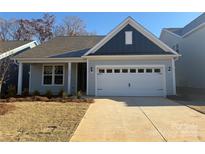 Two-toned exterior of charming new home with attached garage at 1054 Bull Dog Ln # 40, Wingate, NC 28174