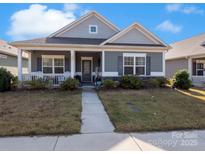 Charming single-story home with a welcoming front porch and well-maintained landscaping at 280 Kerri Dawn Ln, Locust, NC 28097
