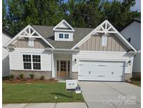 Charming new construction home with a two-car garage and nicely landscaped front yard at 9130 Dulwich Dr # Ken0079, Charlotte, NC 28215