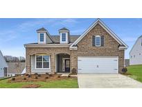 Brick house with a two-car garage and landscaping at 4481 Doyle Ridge Rd, Maiden, NC 28650