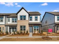 Two-story home with gray and white exterior, landscaping, and walkway at 1194 Lost Cove Rd, Indian Land, SC 29707