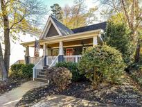 Charming craftsman home with a welcoming front porch and landscaped yard at 716 Ellsworth Rd, Charlotte, NC 28211