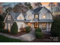 Two-story house with stone accents and a welcoming front porch at 9267 Egret Rdg # 41, Belmont, NC 28012