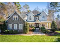 Two-story house with stone accents and a covered porch at 9267 Egret Rdg # 41, Belmont, NC 28012