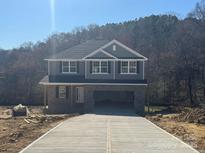 Two-story home featuring a spacious driveway and an attached garage at 200 Fostoria Pl # 78A, Albemarle, NC 28001