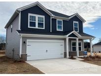 Two-story house with gray and dark gray siding, two-car garage, and landscaping at 1333 Morehead Dr, Salisbury, NC 28144