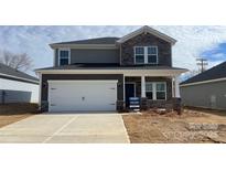 Two-story home with stone accents and a two-car garage at 1345 Morehead Dr, Salisbury, NC 28144